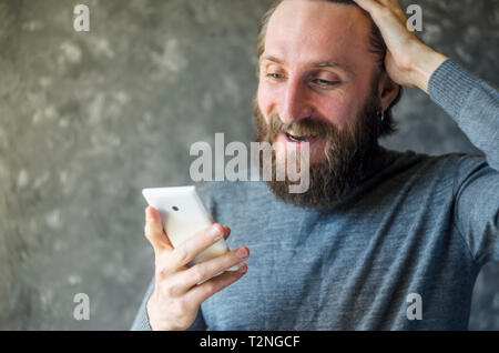 Happy Bearded Man Talk at Phone. Open and Friendly Communication with a Pleasant Interlocutor. Good News Concept Stock Photo
