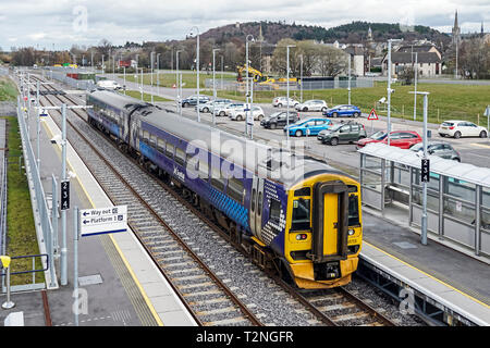 Class 158 DMU departing from New Forres Railway Station in Forres Moray Scotland UK heading towards Aberdeen Stock Photo