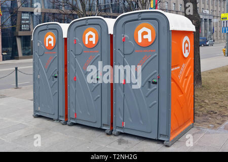 VILNIUS, LITHUANIA - MARCH 02, 2019: Public plastic toilet cabins of the company Mano Aplinka  (My natural environment) on the streets of the spring K Stock Photo