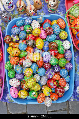 VILNIUS, LITHUANIA - MARCH 02, 2019: Traditional Lithuanian rural  homemade  wooden painted Easters eggs and gifts  are sold on streets during the spr Stock Photo