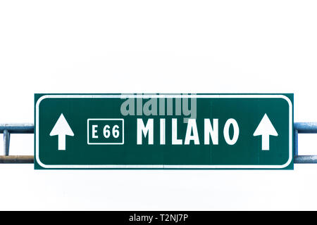 Green highway sign to Milano isolated on white. Stock Photo