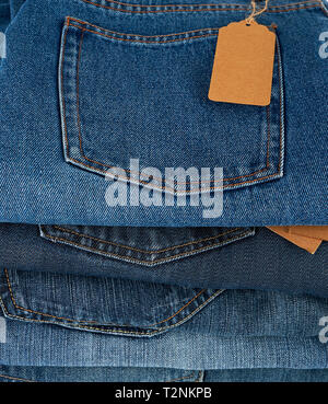 stack of folded blue jeans, close up Stock Photo