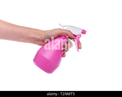 Spray bottle in female hand on a white background. Stock Photo