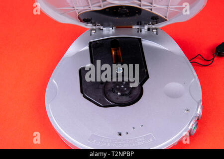 opened retro Discman round on red background Stock Photo
