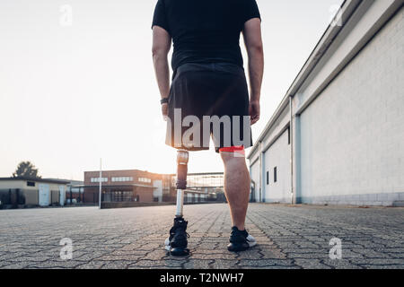 Man with prosthetic leg walking Stock Photo