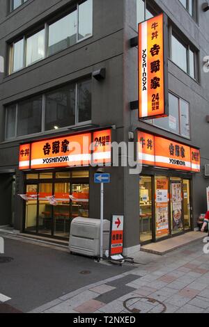 TOKYO, JAPAN - APRIL 13, 2012: Yoshinoya restaurant in Tokyo. Yoshinoya is the largest chain of gyudon restaurants (beef bowl). It was established in  Stock Photo