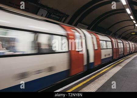 London, UK - March 23, 2019: Train departing London Underground station, motion blur. London Underground is the oldest underground railway in the worl