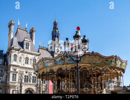 Merry go round on the square in front of the City Hall - Paris Stock Photo