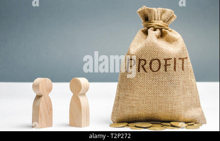 Two businessmen are discussing the company's profit. Search for sources of funding. Business planning. The distribution of costs and resources. Revenu Stock Photo