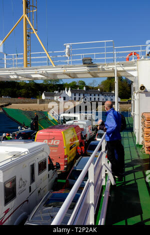 View from the corran ferry as it crosses to the ardgour side of loch linnhe packed with locals and holiday makers on a beautiful day Stock Photo