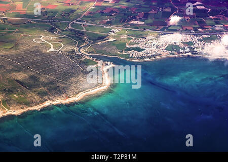 View from an airplane of island of Cyprus. Seacoast line with blue Mediterranean sea Stock Photo