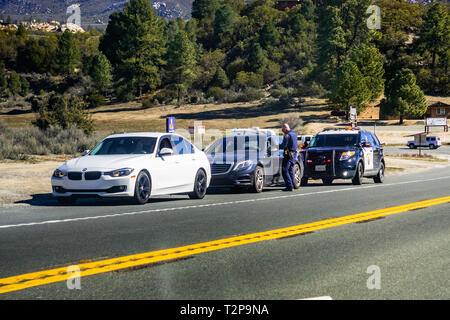 March 17, 2019 Idyllwild / CA / USA - Cars stopped on the right side of the road by the Highway Patrol Stock Photo
