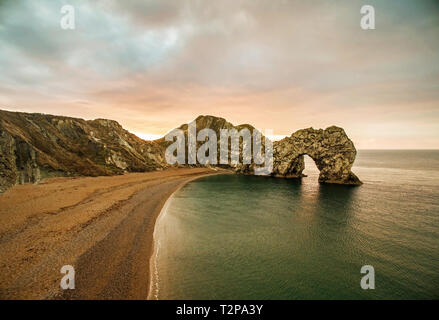 The epic Durdle's door on the Jurassic coast in Dorset, This image was taken shortly after sunrise Stock Photo