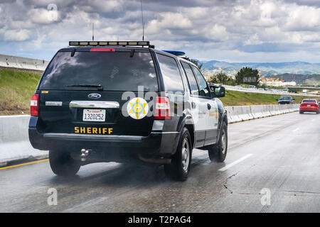 March 20, 2019 Los Angeles / CA / USA - Police car driving on the freeway Stock Photo