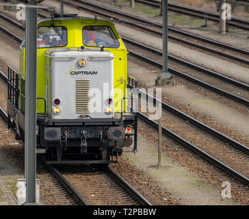 Wolfsburg, Germany, March 20., 2019: Yellow locomotive on the tracks of the Wolfsburg marshalling yard Stock Photo