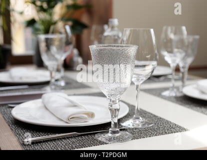 dinner table and nice place setting at the beach restaurant Stock Photo