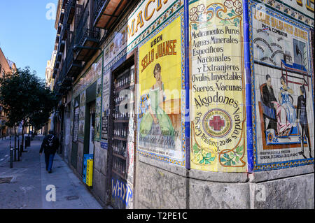 Old tiled advertising on a chemist shop in the Malasana disrict, central Madrid, Spain Stock Photo