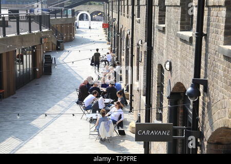Cafes and shops on trendy Lower Stable Street at Coal Drops Yard, at Kings Cross, London, UK Stock Photo