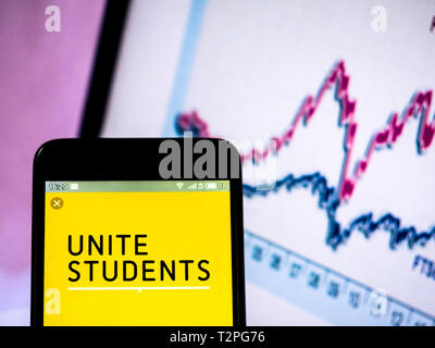 In this photo illustration a Unite Group (Unite Students)  logo seen displayed on a smart phone Stock Photo