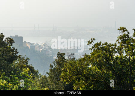 View of Genoa in the fog from Mount Peralto. Italy Stock Photo