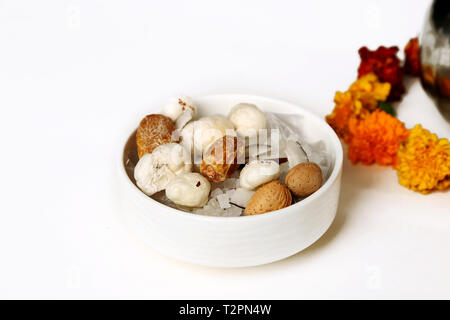 Picture of mix dry fruit in the bowl. ISolated on the white background. Stock Photo