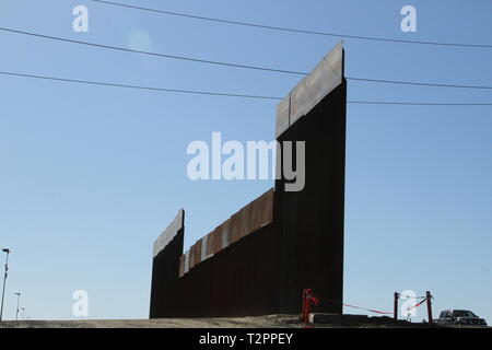 A portion of the 30-foot-tall and 18-foot-tall San Diego secondary border wall which underlies electrical power lines leading into Mexico on March 28, 2019. The Corps is supporting the Department of Homeland Security's request to build additional border wall near San Diego. Stock Photo