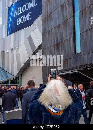 Tottenham Hotspur fans arrive for the first game at the new stadium. Stock Photo