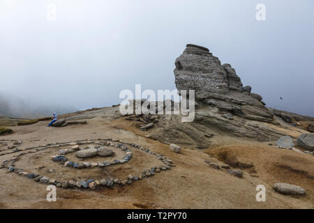 The Sphinx of Bucegi Natural Park, Carpathian Mountains, Romania - in a cloudy summer day. Stock Photo