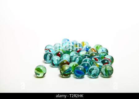 Group of glass marbles isolated on a white background Stock Photo