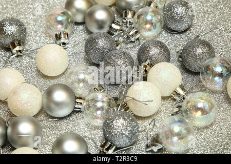 Christmas tree baubles on a silver background Stock Photo