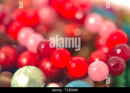 Mixed colors beads close-up made from natural stones or glass marbles Stock Photo