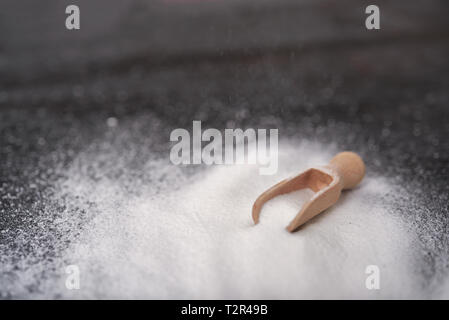 Plate with baking soda on wooden background Stock Photo