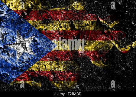 Catalonia smoky mystical flag on the old dirty wall background Stock Photo