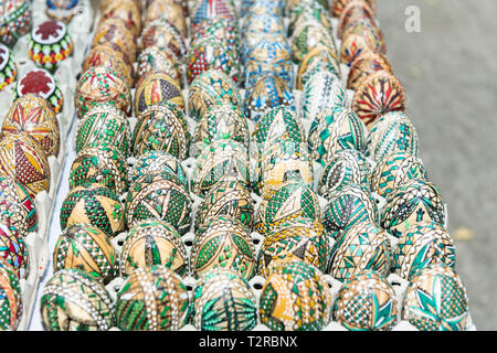 Set of Easter decoration handmade painted eggs in egg carton trays. Stock Photo