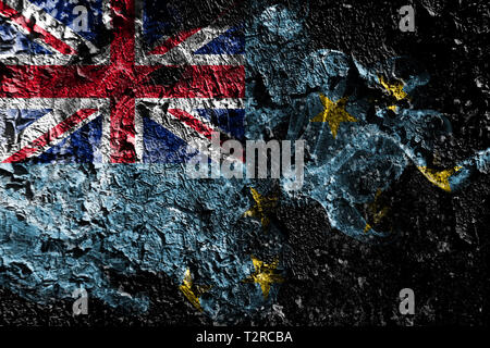 Tuvalu smoky mystical flag on the old dirty wall background Stock Photo