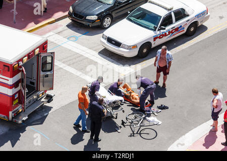 Miami Beach Florida,intersection,corner,accident,cyclist,bicycle,bicycling,riding,biking,rider,injury,injured,adult adults man men male,fire rescue,pa Stock Photo