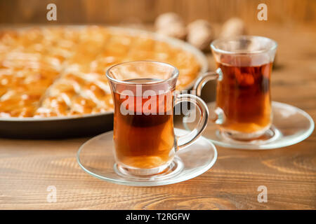 Baklava with nuts on a wooden background. Selective focus. food and drink. Stock Photo