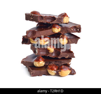 Dark chocolate with hazelnuts. Isolated on white background. Stock Photo