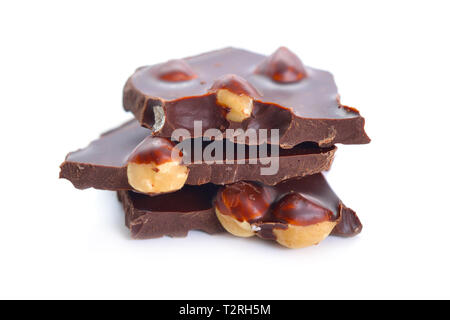 Dark chocolate with hazelnuts. Isolated on white background. Selective focus. Stock Photo