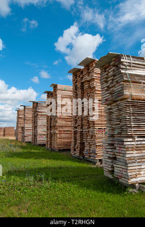 Lumber yard, with stack of wooden boards Stock Photo