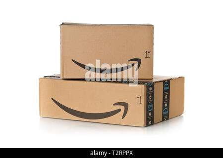 DRESDEN, GERMANY - APRIL 3, 2019 : Stack of Amazon Prime parcels over white background. Prime is a service offered by online retailer Amazon for faste Stock Photo