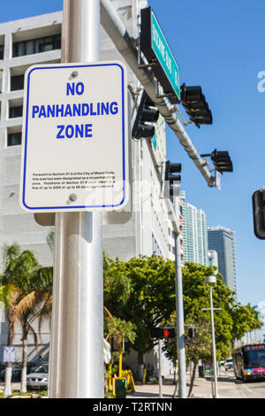 Miami Florida,Biscayne Boulevard,downtown,urban,sign,no panhandling zone,begging,Code section,law,enforcement,warning,imprisonment,fine,FL090424027