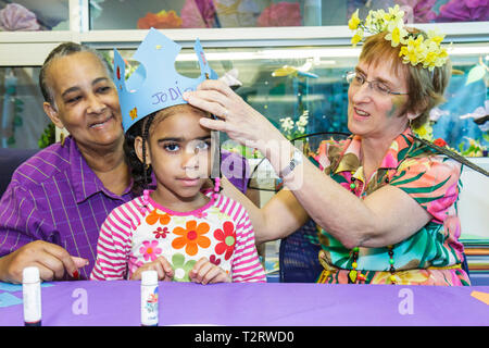 Florida Hollywood,Hollywood Branch Library,Children's BookFest,children's craft,Black Blacks African Africans ethnic minority,adult adults woman women Stock Photo