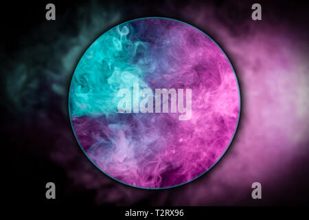 Close-up   thick pink and blue smoke blown under a magnifying glass on a black isolated background. Background from the smoke of vape Stock Photo
