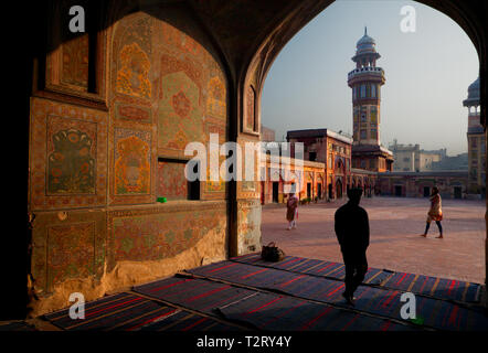 Early morning light strikes on hand painted wall of Masjid Wazir Khan, Lahore. 16th century Mosque is situated in heart of walled city of Lahore. 16th Stock Photo