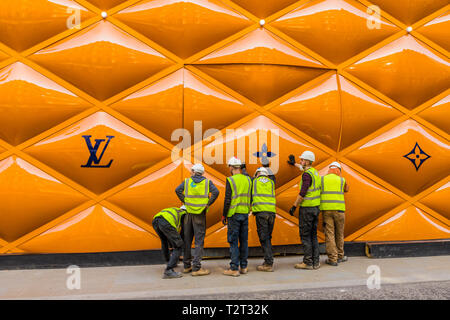 A classically-dressed English gentleman walks past the temporary renovation  hoarding of luxury brand Louis Vuitton in New Bond Street, on 27th February  2019, in London, England Stock Photo - Alamy