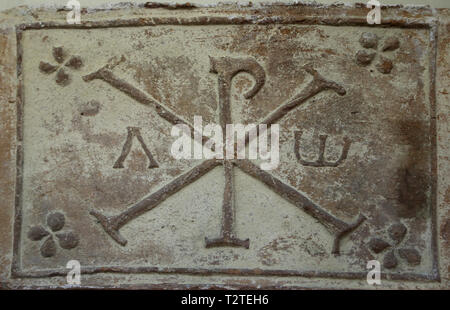 The Chi-Rho symbol with Alpha and Omega. 4th-5th cent. Barcino (Barcelona). Archaeology Museum of Catalonia. Barcelona. Spain. Stock Photo