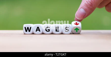 Symbol for a salary increase. Hand turns a dice and changes the direction of an arrow from down to up. Dice form the word 'wages'.