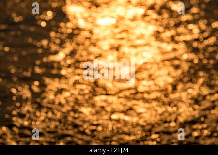 Background texture blurred golden sea in morning Stock Photo