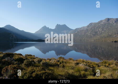 This photograph captures a stunning landscape of Tasmania's Cradle Mountain and Dove Lake from early in the morning. Stock Photo